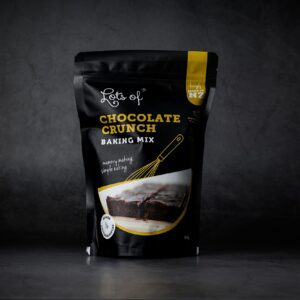 Lots of Baking Mixes Chocolate Crunch Baking Mix pouch on a dark background, New Zealand made chocolate slice baking mix for easy homemade baking.