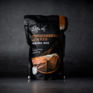 Lots of Baking Mixes Gingerbread Loaves Baking Mix pouch on a dark background, New Zealand made gingerbread loaf baking mix for easy homemade baking.