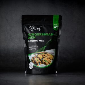 Lots of Baking Mixes Gingerbread Men Baking Mix pouch on a dark background, New Zealand made gingerbread biscuit baking mix for easy homemade baking and decorating.