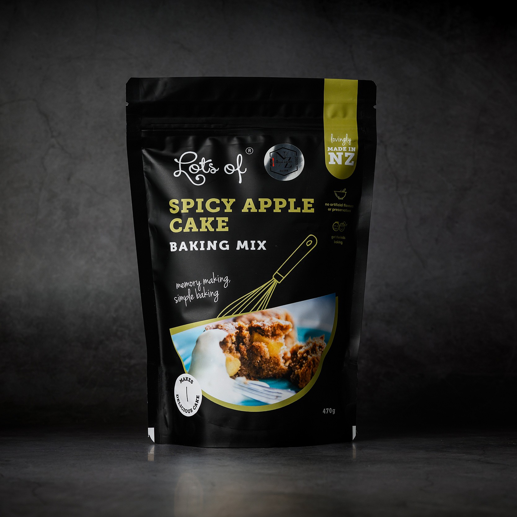 Spicy Apple Cake Baking Mix 4 Lots of Baking Mixes Spicy Apple Cake Baking Mix pouch on a dark background, New Zealand made apple spice cake baking mix for easy homemade baking.